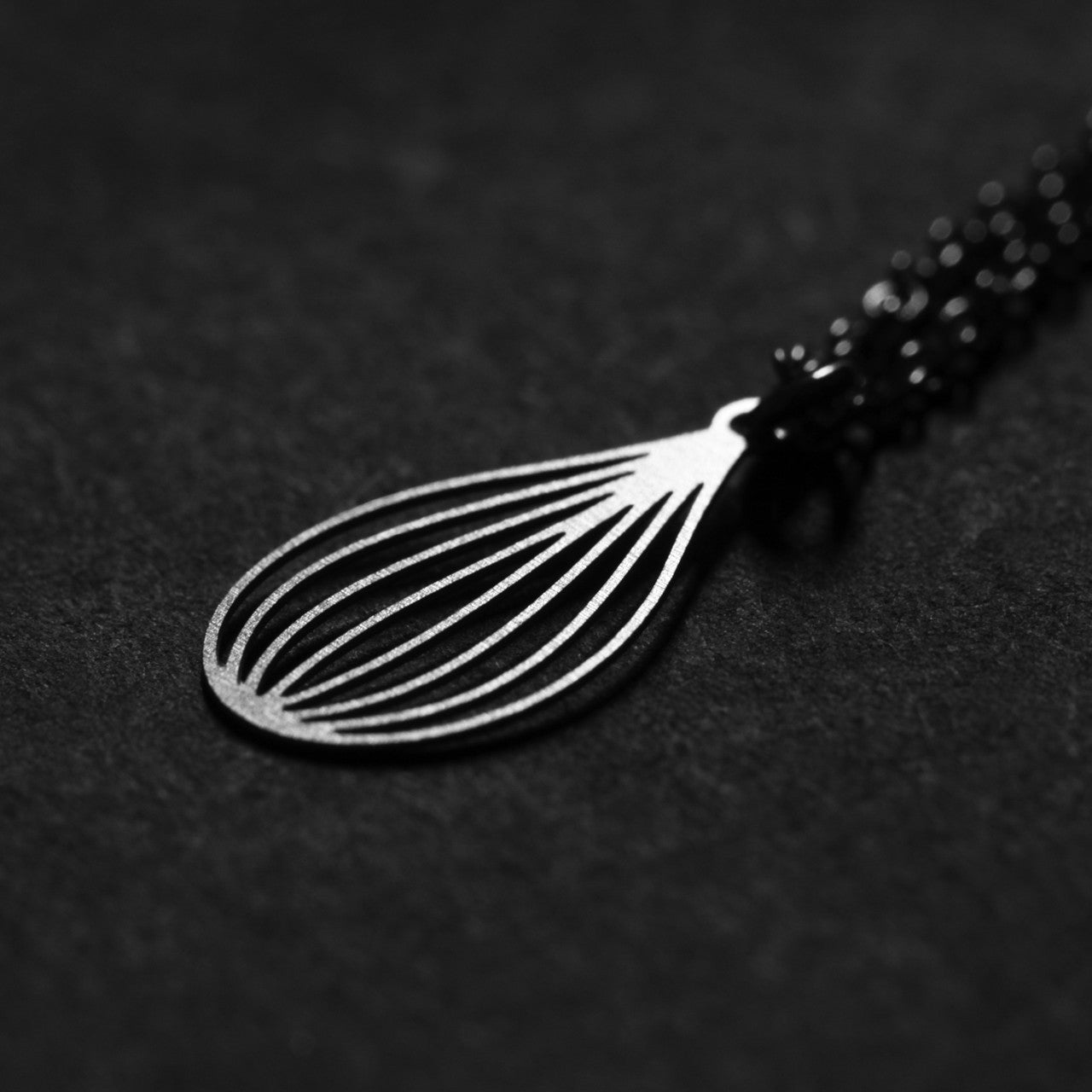 Moorigin laser cut steel necklace with seed motif