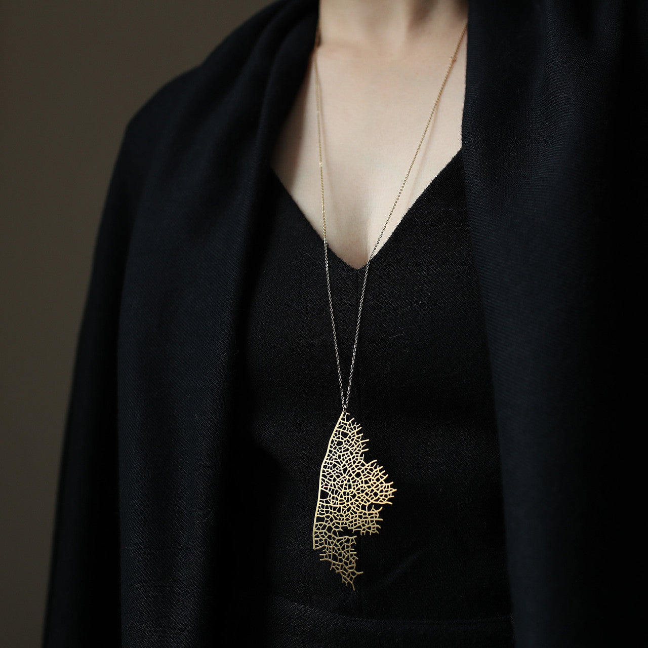 Moorigin gold plated stainless steel pendant with skeleton leaf motif