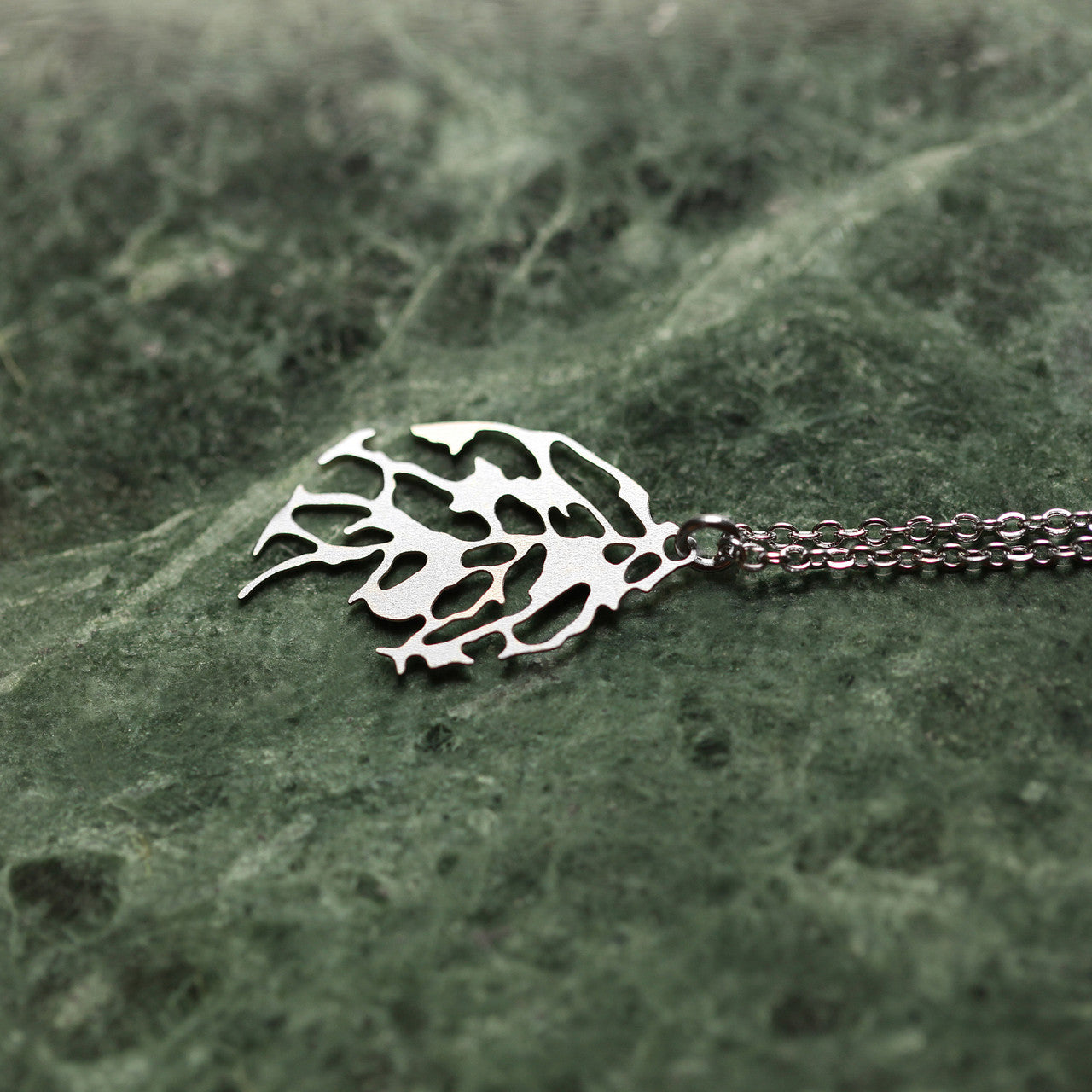 Moorigin laser cut stainless steel necklace with leaf motif