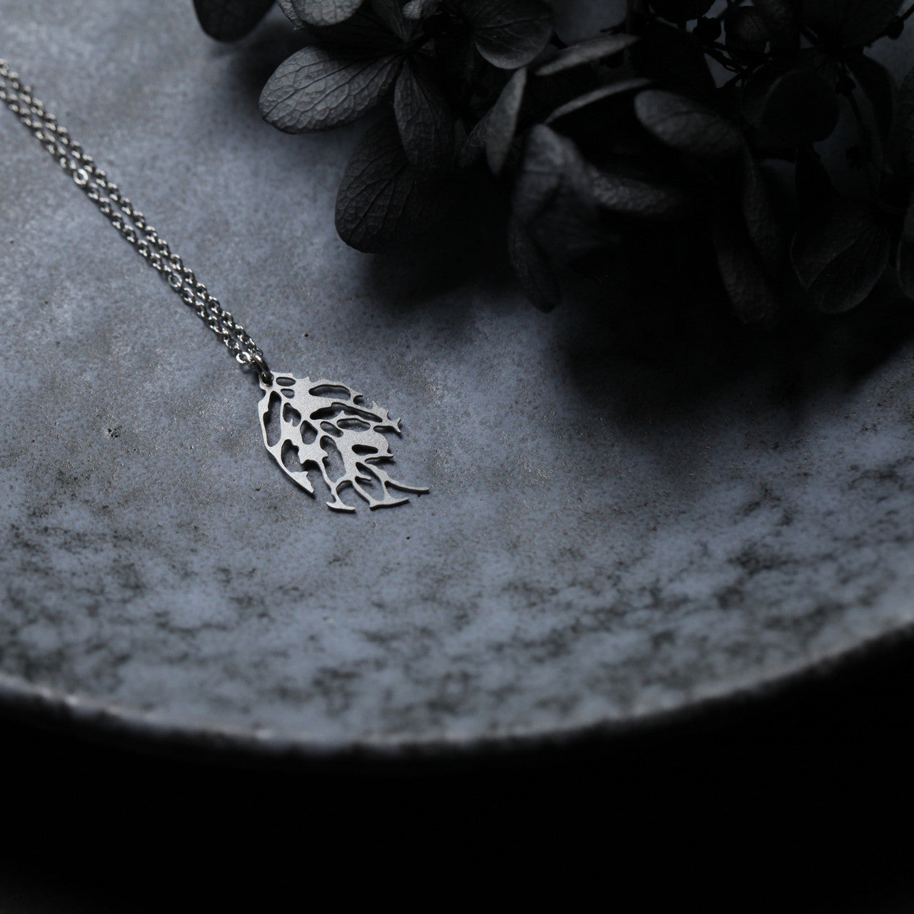 Moorigin laser cut stainless steel necklace with leaf motif